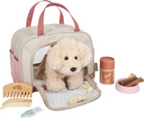 Hund mit Tasche und Pflege-Set
