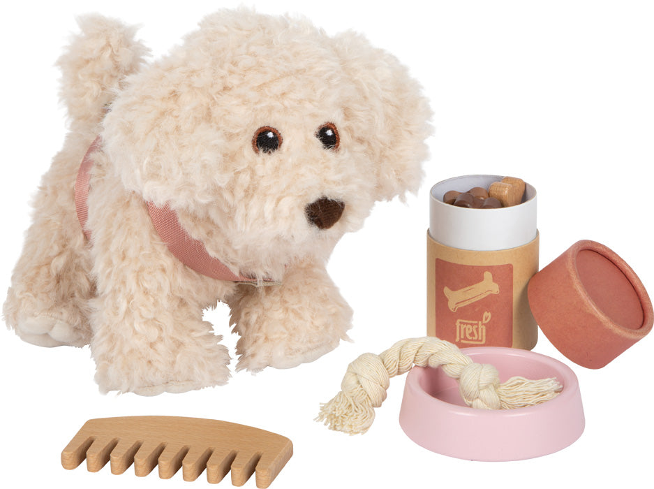 Hund mit Tasche und Pflege-Set