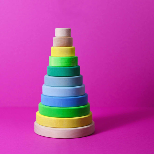Großer neon-grüner Scheibenturm aus Holz zum Spielen und Dekorieren im Kleinkinderzimmer