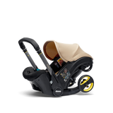 Doona i Babyschale in Sahara Sand mit 2-in-1 Autositz und Kinderwagenfunktion, Sicherheitsgurten und Seitenaufprallschutz